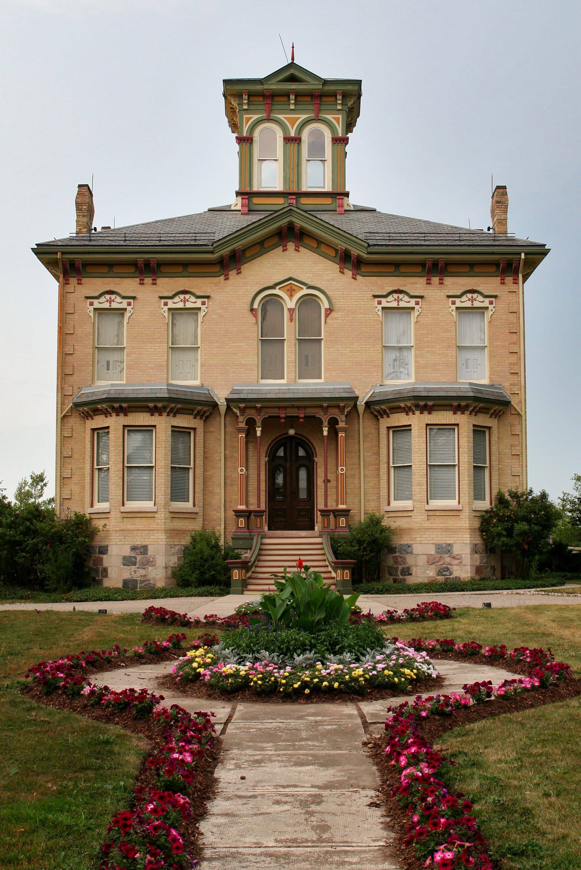Castle Kilbride's flower-lined front walk in summer